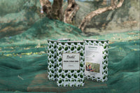 3 tins of 100% Italian extra virgin olive oil sitting on olive capture nets from the annual harvest. 