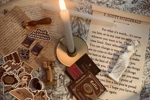 Curated Dark Academia subscription box featuring art prints, stationery, bookish items, home decor, and vintage-inspired accessories 