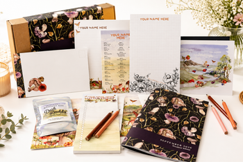 Woodland-themed personalized stationery box with custom paper goods, notepads, cards, and desk accessories.