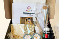 Unboxed Teens and Adults art kit showing gold leaf, oil paint tubes, brushes and the illustrated Gustav Klimt guide