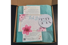 Luxury spa gift box featuring natural bath and body products from Tranquil Rose Spa-themed subscription box with wooden soap dish, bath prod