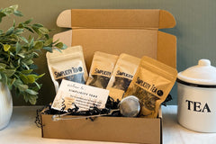 Holiday Gift Box with four premium teas, a Metal Tea Infuser and Wellness Tips Card. Perfect gift of tea and wellness. One time purchase 