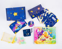 A colorful display of Tía’s Box of Treasures with the 'Tía Is...' book, sensory items, keepsakes, and monthly treasures