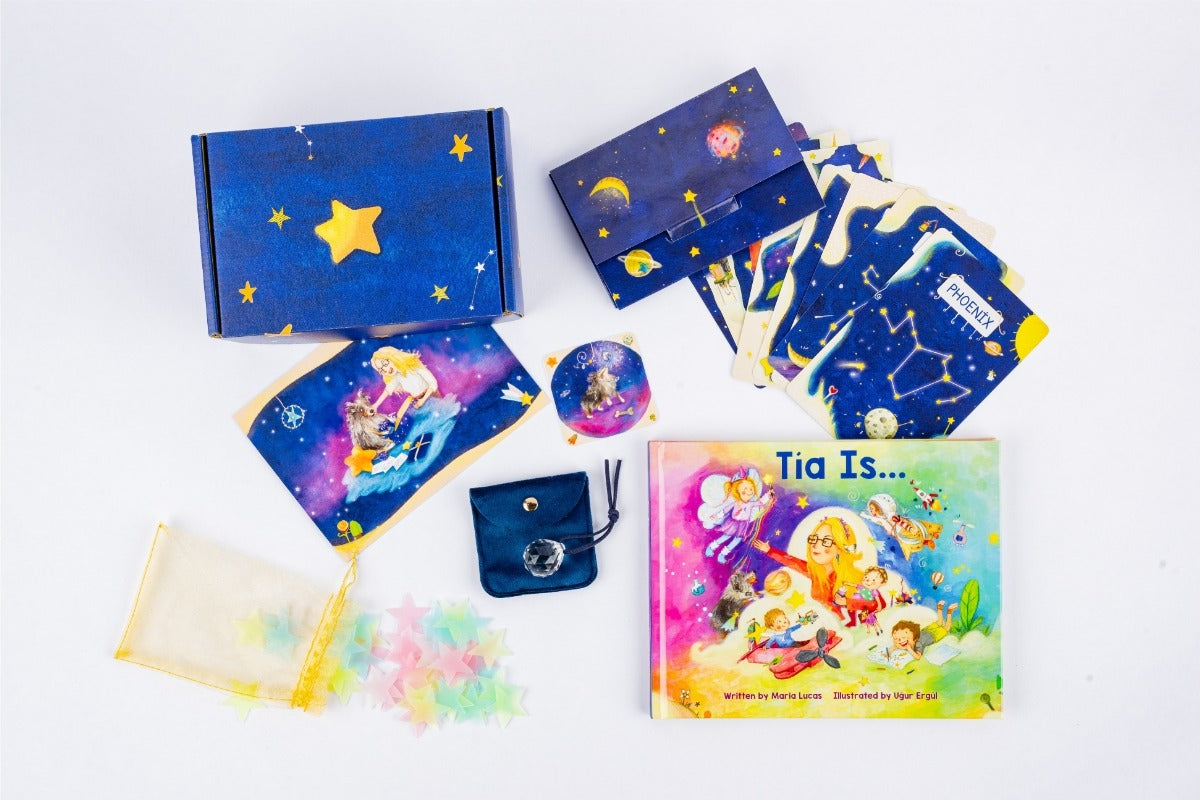 A colorful display of Tía’s Box of Treasures with the 'Tía Is...' book, sensory items, keepsakes, and monthly treasures