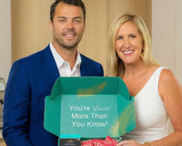 Founder holding Senior Joy Box, smiling while presenting a curated gift for seniors and loved ones in their live