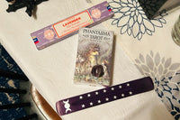 Phantasma tarot by Paulina fae, satya incense in lavender, purple incense holder with triple moon and star design, amethyst crystal