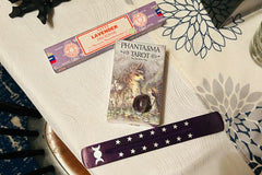 Phantasma tarot by Paulina fae, satya incense in lavender, purple incense holder with triple moon and star design, amethyst crystal