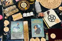 Oracle decks, wooden runes, pendulum, crystal chips, dice, incense holder, selenite Tower, essential oils