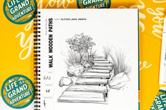 monthly sketchpad with daily drawing prompts with the theme grand adventure and drawing prompts that relate to locations and adventures.