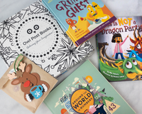 Owl Post Books kids subscription box with holiday gift books Around the World, This Is Not a Dragon Party, and fun reindeer craft.