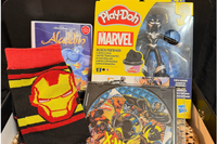 The Comics box including Marvel Play-Doh, Iron Man Socks, X-Men Comics Disk and an Aladdin Comic Book.