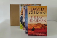 Brown subscription box filled with four historical fiction books, featuring rich narratives and captivating tales set in different eras.