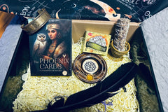 the phoenix cards oracle, good fortune incense cones by HEM, yerba Smudge stick, incense holder, feather, copper bracelet
