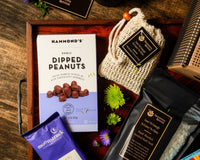 Introverts Retreat box image of a box with bath salt soaks, dark chocolate drinking cocoa and a box of dipped peanuts.