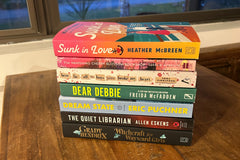 Paperback book stack of newly released paperback books. Multiple genres are included to provide a broad variety of interests.