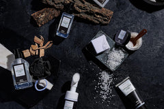 Beautiful high quality photo of a skin care and spa products for men. There is a blooming serum and many more.