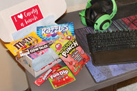 I heart candy a bunch assortment box from All City Candy is perfect for all genders.  Candy is universal and fun for all ages.  