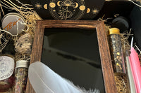 Our Full Moon in Libra offering includes, mica infused ritual salt, gold and pink spell candles, a black mirror, + more!
