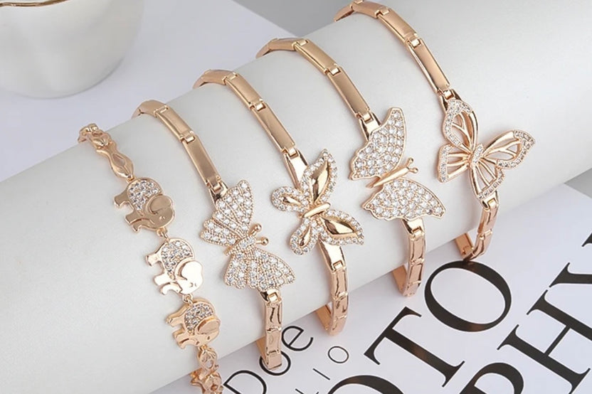 This beautiful photo shows (6) 585 14k gold bracelets with AAAclarity 1ct. weight Chrystal’s and zircon gems