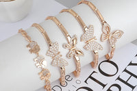 This beautiful photo shows (6) 585 14k gold bracelets with AAAclarity 1ct. weight Chrystal’s and zircon gems