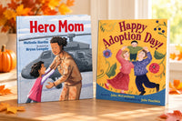 Two children's books included in the November Celebrations box are displayed with their covers visible: Hero Mom and Happy Adoption Day