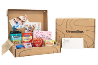 Grandbox Valentine’s Day gift box with snacks, chocolates, family photos and a personalized card, designed as a care package for loved ones.