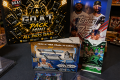The G.O.A.T Pack Mini sealed multi-sport trading card mystery box displayed with basketball, baseball and football card packs, hobby boxes a