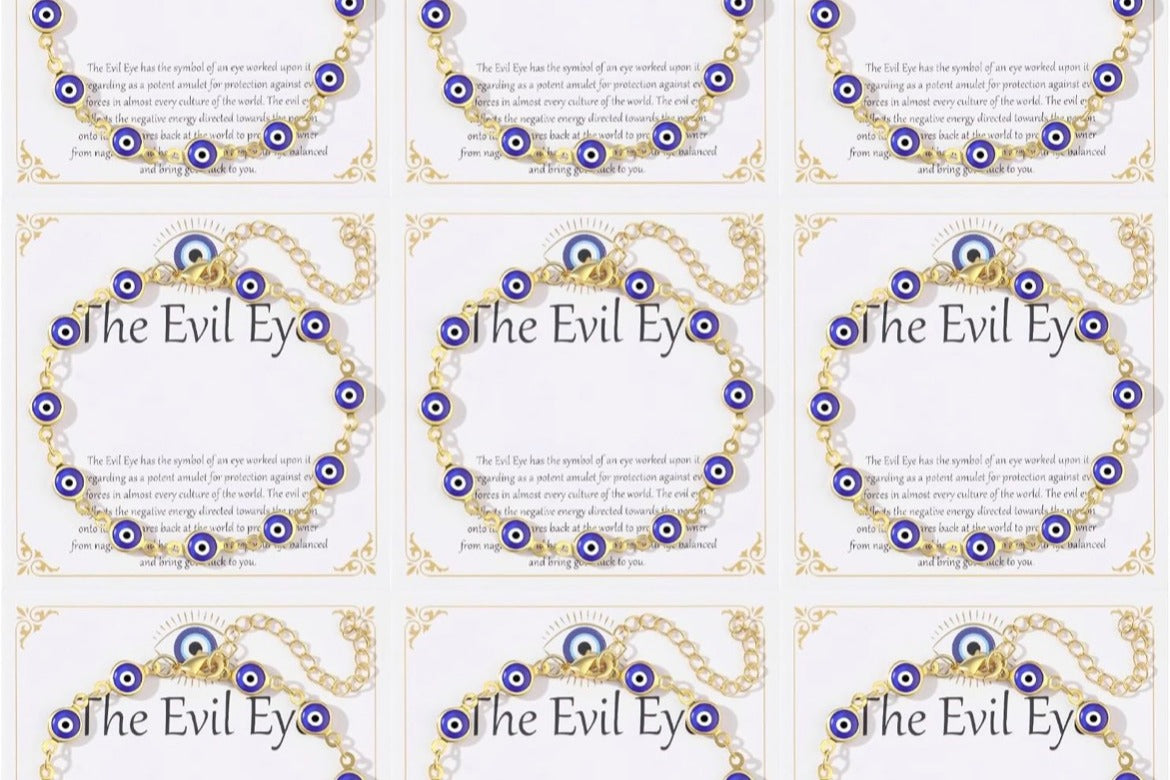 Nine 14K gold plated evil eye bracelets displayed on white 'The Evil Eye' gift cards, each with blue evil eye charms on a gold-tone chain.