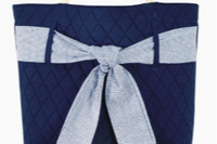 Navy quilted handbag with rope handles and a blue and white striped nautical bow.  A fabulous accessory for spring and summer.