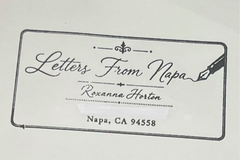 Letters From Napa mailing envelope featuring decorative script branding and a fountain pen design, with the street address concealed.