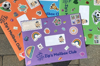 Four hand-decorated Zip's Mailbox Club envelopes in orange, blue, green and purple, each covered with stickers and real postage stamps.