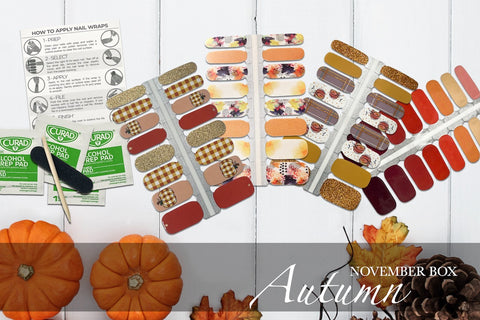 flat lay image showing four autumn nail wrap styles, four alcohol prep pads, a cuticle pusher, a mini nail file, and instructions