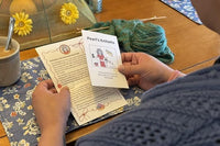 Knit Snail Mail club member with her letter. Each month's mailing includes a letter, cartoon, cookie recipe and fun suprises.