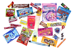 So many candy treats will be included each month.  This shows a flat lay out of some examples like M&M peanut, bottlecaps, Laffy Taffy, etc.