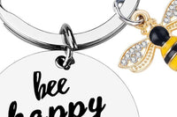 Bee happy keychain with bee charm and cheerful message that fits the uplifting kindness theme of the Bee Kind Appreciation Box.