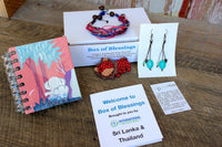 Box of Blessings featuring Sri Lanka and Thailand: Mr. Ellie Pooh notebook, turquoise hanging earrings, wax thread bracelet, lion magnet