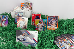 Arrangement of a relic baseball cards, and 30 other cards, along with two baseball card packs and a baseball