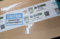 A Cardboard box with custom printed tape with "Lil Monsters Bird Toys", a logo, QR code, website, and "Caution: Contents May Attract Parrots