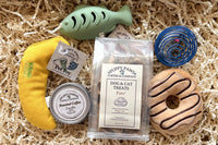Paws for A Cause - Cat Box includes:
Two cat toys
One Large bag pet treats
One Lagniappe gift for the human