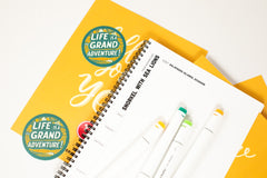 monthly sketchpad with daily drawing prompts with the theme grand adventure and drawing prompts that relate to locations and adventures.