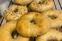 This image shows bagels that have been baked using Risen Sourdough Starter Co.'s Starter. We added it to our baked goods !