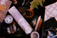 Samhain Witchcraft Subscription Box featuring crystals, candles, herbs, and ritual tools for Sabbat celebrations