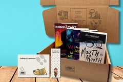 Brown box filled with crime thriller books, showcasing a variety of gripping titles and intriguing covers, perfect for mystery lovers.