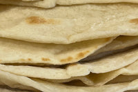 This image shows tortillas that has been baked using Risen Sourdough Starter Co.'s Starter. We added it to our baked goods !