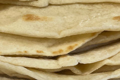 This image shows tortillas that has been baked using Risen Sourdough Starter Co.'s Starter. We added it to our baked goods !