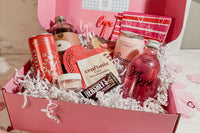 Every subscription ships in the preppy pink box filled with white crinkle cut and blue gingham napkins.