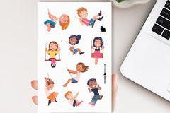 A hand holding a sticker sheet with a laptop in the background.  The sticker sheet is of children on swings, with hair blowing wildly