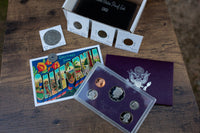 California Coin box with United States Treasury Proof set, Eisenhower dollar, foreign coins, and more. 