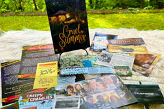 Previously released mystery titled Cruel Summer. Showing journal, evidence, and clues spread out on table. 