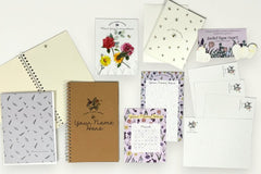 Box Overview / Flat Lay items. Custom name notepad from personalized stationery subscription set with themed design